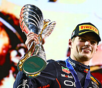 ABU DHABI, UNITED ARAB EMIRATES - NOVEMBER 20: Race Winner Max Verstappen of the Netherlands and Oracle Red Bull Racing and Third placed Sergio Perez of Mexico and Oracle Red Bull Racing celebrate on the podium during the F1 Grand Prix of Abu Dhabi at Yas Marina Circuit on November 20, 2022 in Abu Dhabi, United Arab Emirates. (Photo by Mark Thompson/Getty Images) // Getty Images / Red Bull Content Pool // SI202211202732 // Usage for editorial use only //